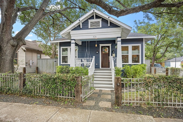 826 Omar St, Houston, TX 77009 - shotgun-style home with a porch