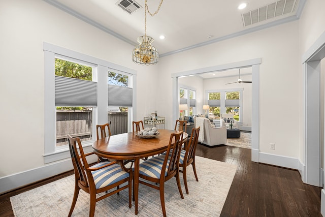 826 Omar St, Houston, TX 77009 - dining room featuring crown molding, plenty of natural light, a chandelier, wood-type flooring, and recessed lighting