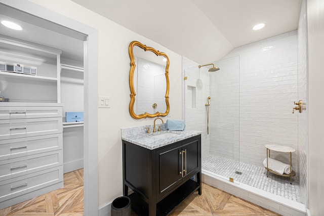 826 Omar St, Houston, TX 77009 - bathroom with tiled shower, vanity, vaulted ceiling, and recessed lighting