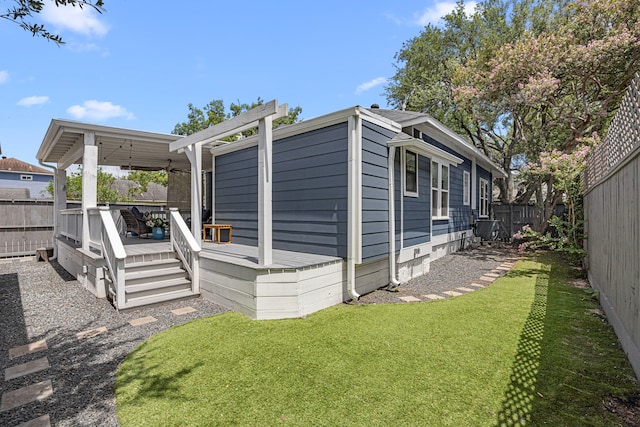 826 Omar St, Houston, TX 77009 - view of side of home featuring a fenced backyard, a deck, and ceiling fan