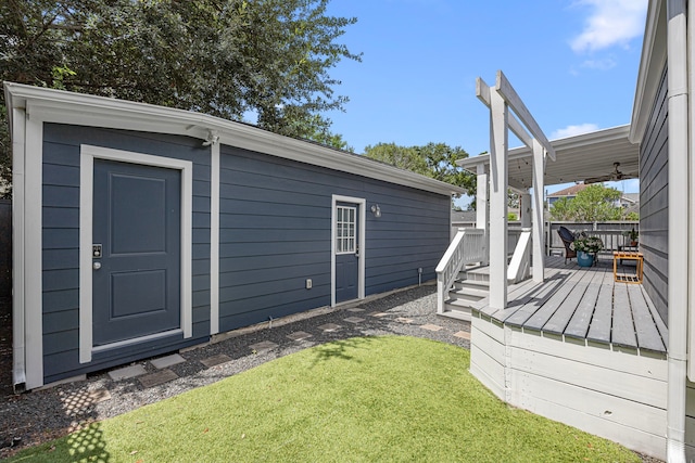 826 Omar St, Houston, TX 77009 - view of grassy yard with a wooden deck and an outbuilding