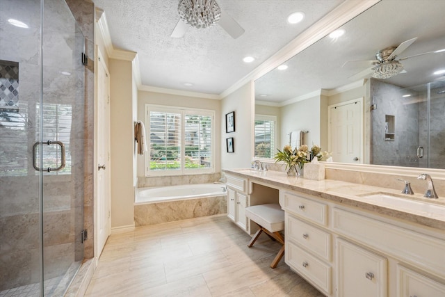 15927 Meadowside Dr, Houston, TX 77062 - bathroom featuring ceiling fan, double vanity, a bath, a stall shower, and recessed lighting