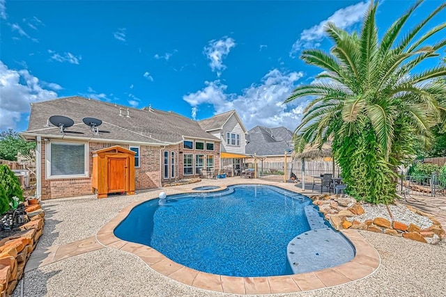 13311 Barbstone Dr, Houston, TX 77044 - view of pool with a fenced backyard, a patio, and a pool with connected hot tub