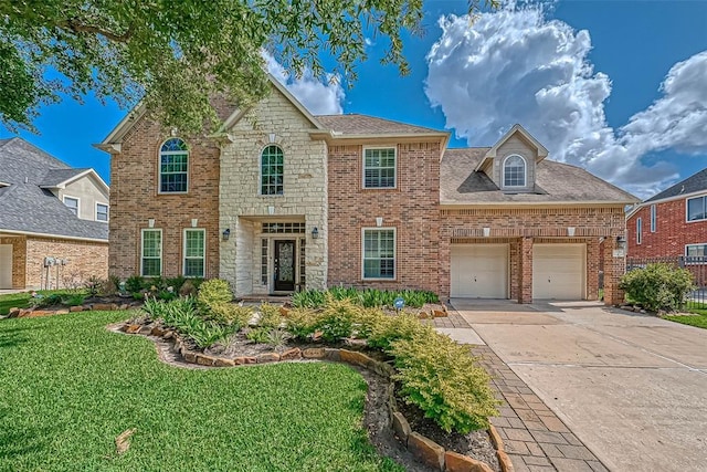 13311 Barbstone Dr, Houston, TX 77044 - view of front of property with driveway, a front yard, brick siding, and an attached garage