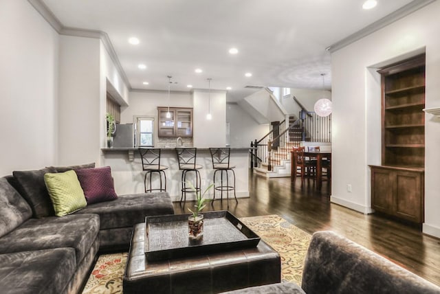 4247 Dickson St, Houston, TX 77007 - living area featuring wood finished floors, stairs, recessed lighting, ornamental molding, and baseboards