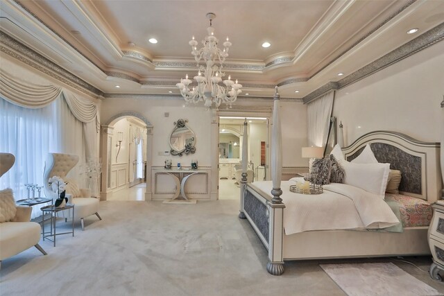 17122 Ashley Woods Ct, Spring, TX 77379 - bedroom featuring arched walkways, crown molding, a tray ceiling, carpet floors, and a chandelier
