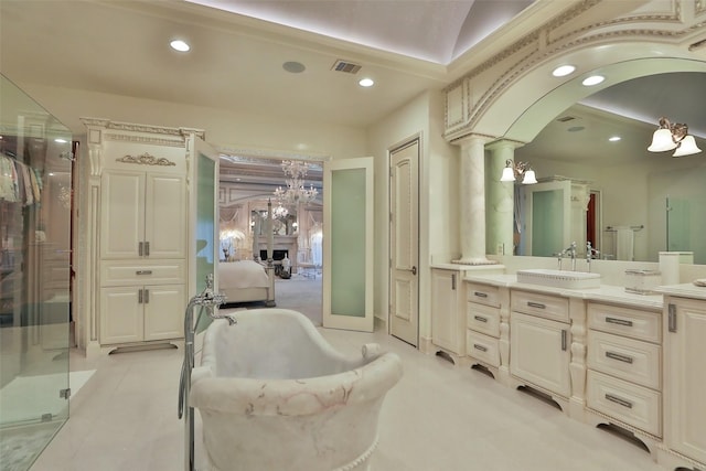 17122 Ashley Woods Ct, Spring, TX 77379 - bathroom with vanity, a soaking tub, a shower stall, recessed lighting, and a chandelier