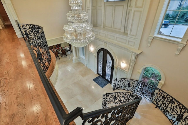 17122 Ashley Woods Ct, Spring, TX 77379 - foyer with a chandelier, french doors, arched walkways, and ornate columns