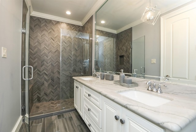 17122 Ashley Woods Ct, Spring, TX 77379 - bathroom featuring double vanity, crown molding, a shower stall, and recessed lighting