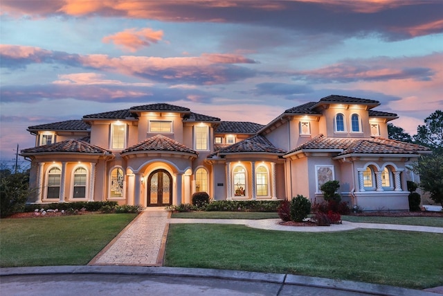 17122 Ashley Woods Ct, Spring, TX 77379 - mediterranean / spanish house featuring french doors, a yard, stucco siding, and a tiled roof