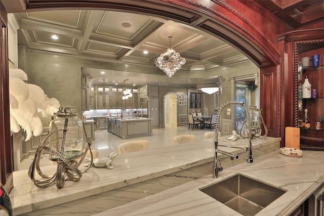 17122 Ashley Woods Ct, Spring, TX 77379 - bar area with arched walkways, a sink, coffered ceiling, ornamental molding, and a chandelier