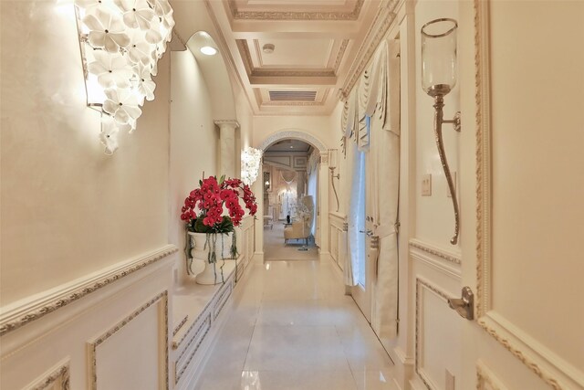 17122 Ashley Woods Ct, Spring, TX 77379 - hallway with a chandelier, light tile patterned flooring, crown molding, arched walkways, and coffered ceiling