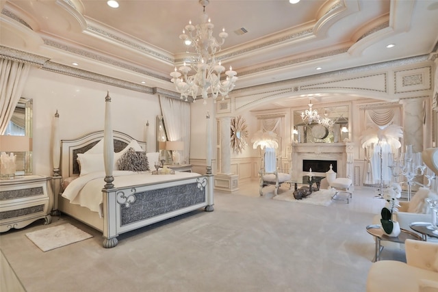 17122 Ashley Woods Ct, Spring, TX 77379 - bedroom with a chandelier, ornamental molding, a decorative wall, a fireplace, and a wainscoted wall