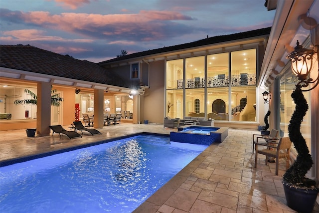 17122 Ashley Woods Ct, Spring, TX 77379 - view of swimming pool with a patio, a pool with connected hot tub, and an outdoor living space
