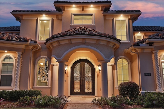 17122 Ashley Woods Ct, Spring, TX 77379 - property entrance featuring a tiled roof and stucco siding