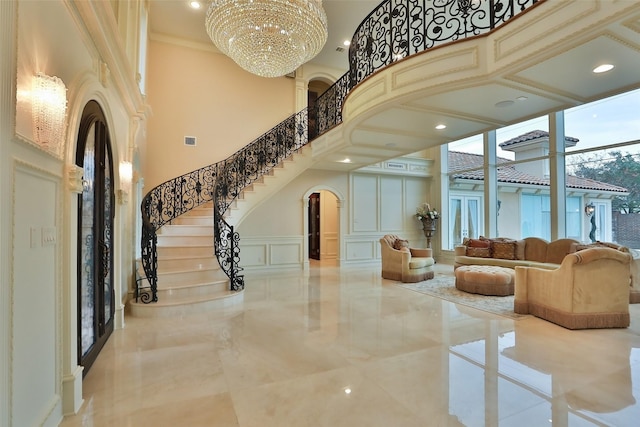 17122 Ashley Woods Ct, Spring, TX 77379 - common area with a towering ceiling, a decorative wall, stairway, recessed lighting, and a wainscoted wall