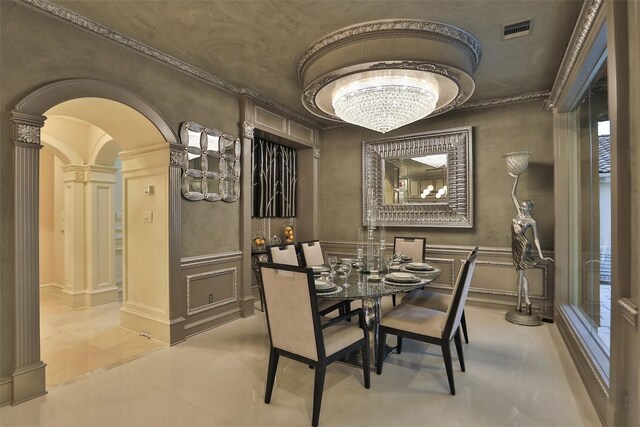 17122 Ashley Woods Ct, Spring, TX 77379 - dining area featuring decorative columns, arched walkways, a chandelier, light tile patterned flooring, and crown molding