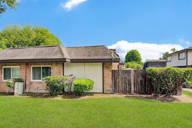 12028 Mighty Oak Dr Unit A, Houston, TX 77066 - view of side of property with brick siding and a shingled roof