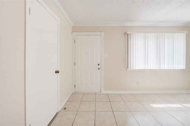 12028 Mighty Oak Dr Unit A, Houston, TX 77066 - entryway with a textured ceiling, ornamental molding, light tile patterned floors, and baseboards