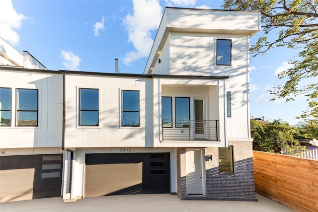 2312 Barbee St, Houston, TX 77004 - modern home with an attached garage, brick siding, and driveway