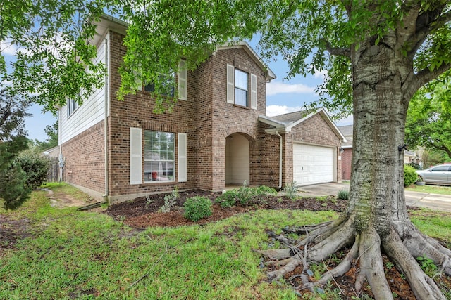 25430 Twister Trl, Spring, TX 77373 - traditional-style house featuring brick siding, a garage, and concrete driveway