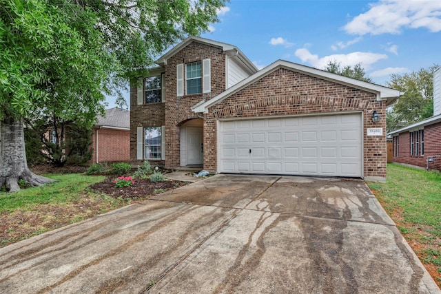 25430 Twister Trl, Spring, TX 77373 - traditional-style house with brick siding, concrete driveway, and an attached garage