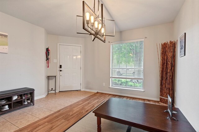25430 Twister Trl, Spring, TX 77373 - unfurnished dining area featuring light wood finished floors, a chandelier, and baseboards