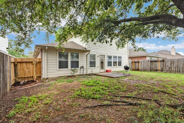 25430 Twister Trl, Spring, TX 77373 - back of property featuring a fenced backyard and a patio