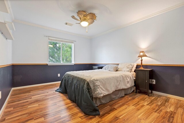25430 Twister Trl, Spring, TX 77373 - bedroom with wood finished floors, ornamental molding, baseboards, and ceiling fan