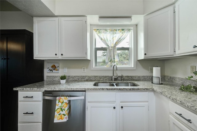 11111 Clear Fork Dr, Humble, TX 77396 - kitchen featuring dishwasher, a sink, white cabinets, and light stone countertops