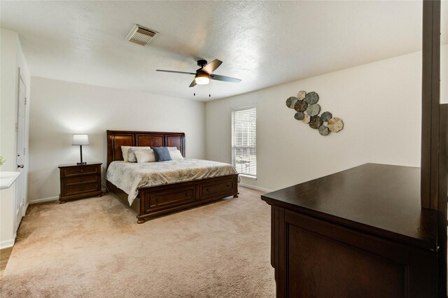 11111 Clear Fork Dr, Humble, TX 77396 - bedroom with ceiling fan, baseboards, and light carpet