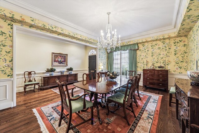 7 Pine Briar Cir, Houston, TX 77056 - dining area with wallpapered walls, a chandelier, dark wood finished floors, a wainscoted wall, and ornamental molding