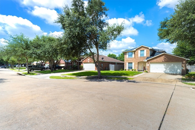 14639 Cypress Cottage Ct, Cypress, TX 77429 - view of front of house featuring brick siding, driveway, and an attached garage