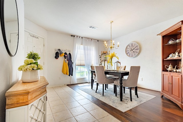14639 Cypress Cottage Ct, Cypress, TX 77429 - dining area with a chandelier, light wood-type flooring, and baseboards