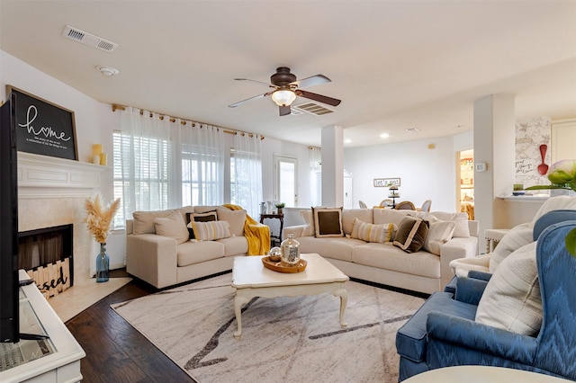 14639 Cypress Cottage Ct, Cypress, TX 77429 - living room featuring a ceiling fan, wood finished floors, a tiled fireplace, and recessed lighting