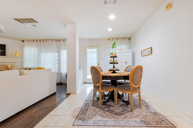 14639 Cypress Cottage Ct, Cypress, TX 77429 - dining space with light tile patterned flooring, recessed lighting, and baseboards