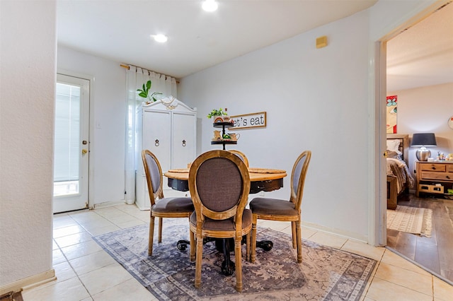 14639 Cypress Cottage Ct, Cypress, TX 77429 - dining room with light tile patterned flooring, recessed lighting, and baseboards