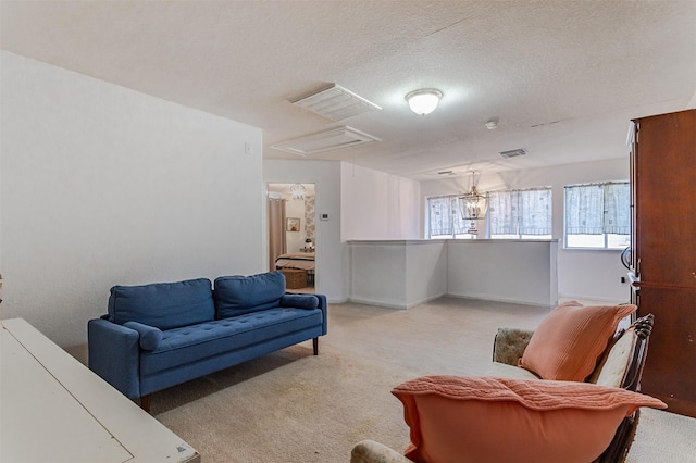 14639 Cypress Cottage Ct, Cypress, TX 77429 - living room featuring attic access, light carpet, and a textured ceiling