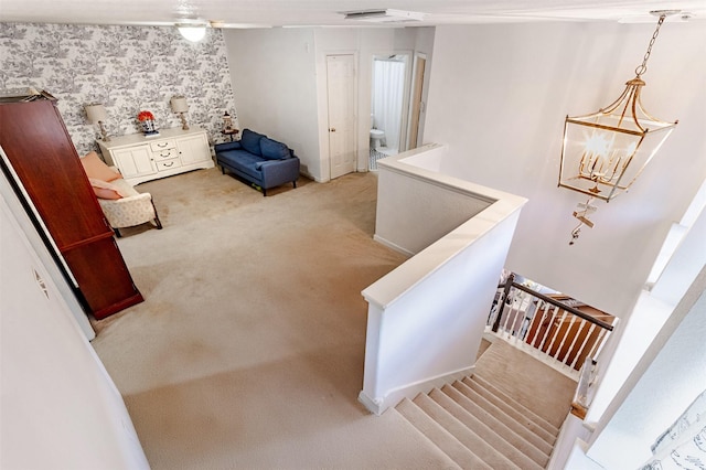 14639 Cypress Cottage Ct, Cypress, TX 77429 - stairs featuring carpet floors, wallpapered walls, and a chandelier
