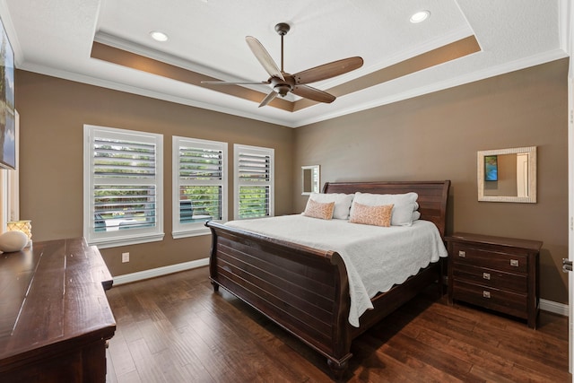 6014 Charrington Dr, Spring, TX 77389 - bedroom with a tray ceiling, dark wood finished floors, baseboards, ornamental molding, and recessed lighting
