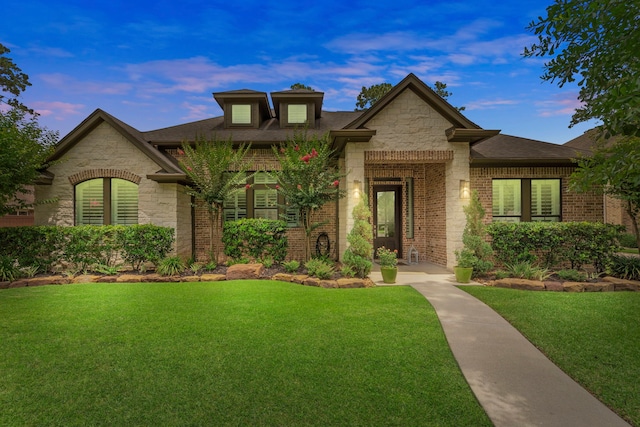 6014 Charrington Dr, Spring, TX 77389 - view of front of property with stone siding, a front lawn, and brick siding