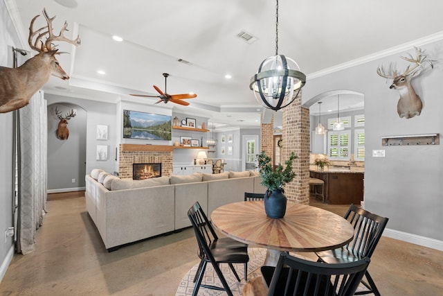 6014 Charrington Dr, Spring, TX 77389 - dining room featuring arched walkways, concrete floors, baseboards, ornamental molding, and recessed lighting