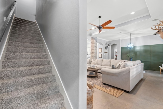 6014 Charrington Dr, Spring, TX 77389 - stairs featuring arched walkways, a ceiling fan, finished concrete floors, and crown molding
