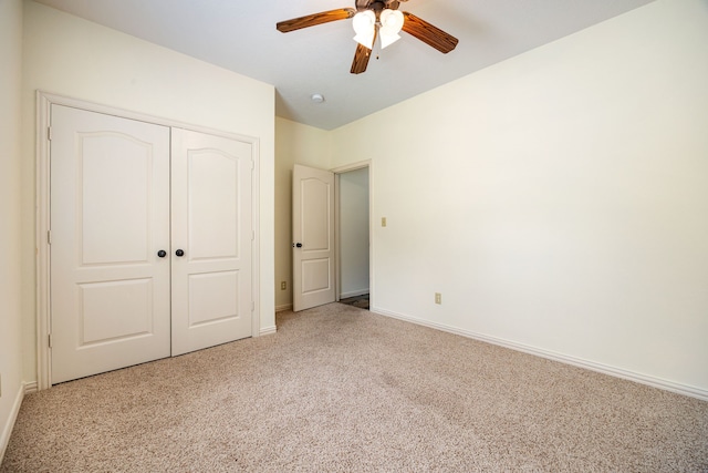 40614 Rolling Forest Dr, Magnolia, TX 77354 - unfurnished bedroom with carpet, a closet, baseboards, and ceiling fan