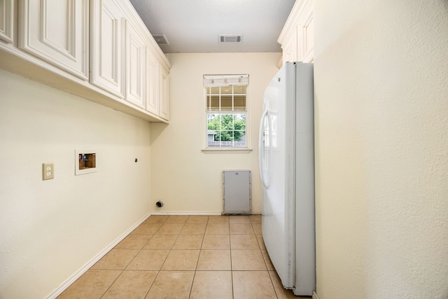 40614 Rolling Forest Dr, Magnolia, TX 77354 - laundry area featuring cabinet space, light tile patterned flooring, baseboards, hookup for a washing machine, and hookup for an electric dryer