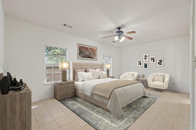 40614 Rolling Forest Dr, Magnolia, TX 77354 - bedroom featuring light tile patterned flooring, a ceiling fan, and baseboards