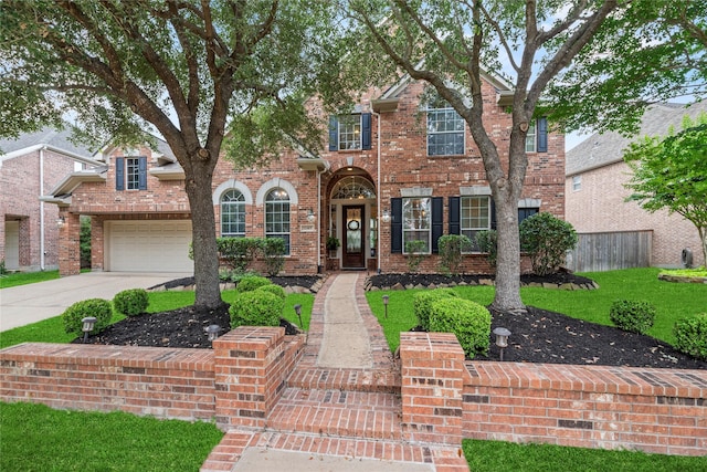 12415 Bunker Cove Dr, Cypress, TX 77433 - traditional-style house featuring brick siding and driveway
