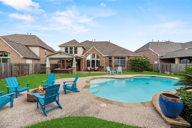 12415 Bunker Cove Dr, Cypress, TX 77433 - view of pool with a fire pit, a patio area, a fenced backyard, and a hot tub