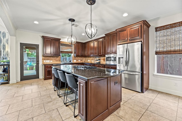 12415 Bunker Cove Dr, Cypress, TX 77433 - kitchen with appliances with stainless steel finishes, backsplash, a chandelier, crown molding, and baseboards