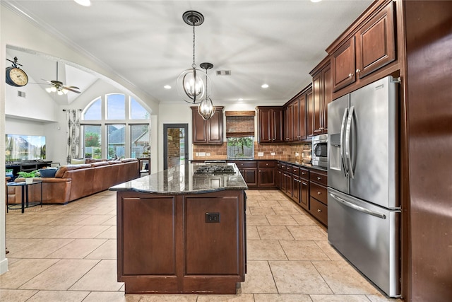 12415 Bunker Cove Dr, Cypress, TX 77433 - kitchen featuring appliances with stainless steel finishes, healthy amount of natural light, a ceiling fan, tasteful backsplash, and crown molding